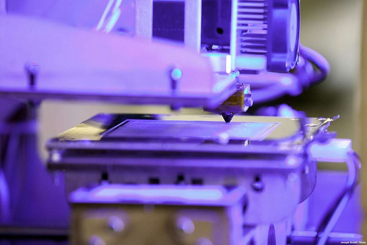 A close-up of a 3D printer at work at the TechShop in San Francisco.
