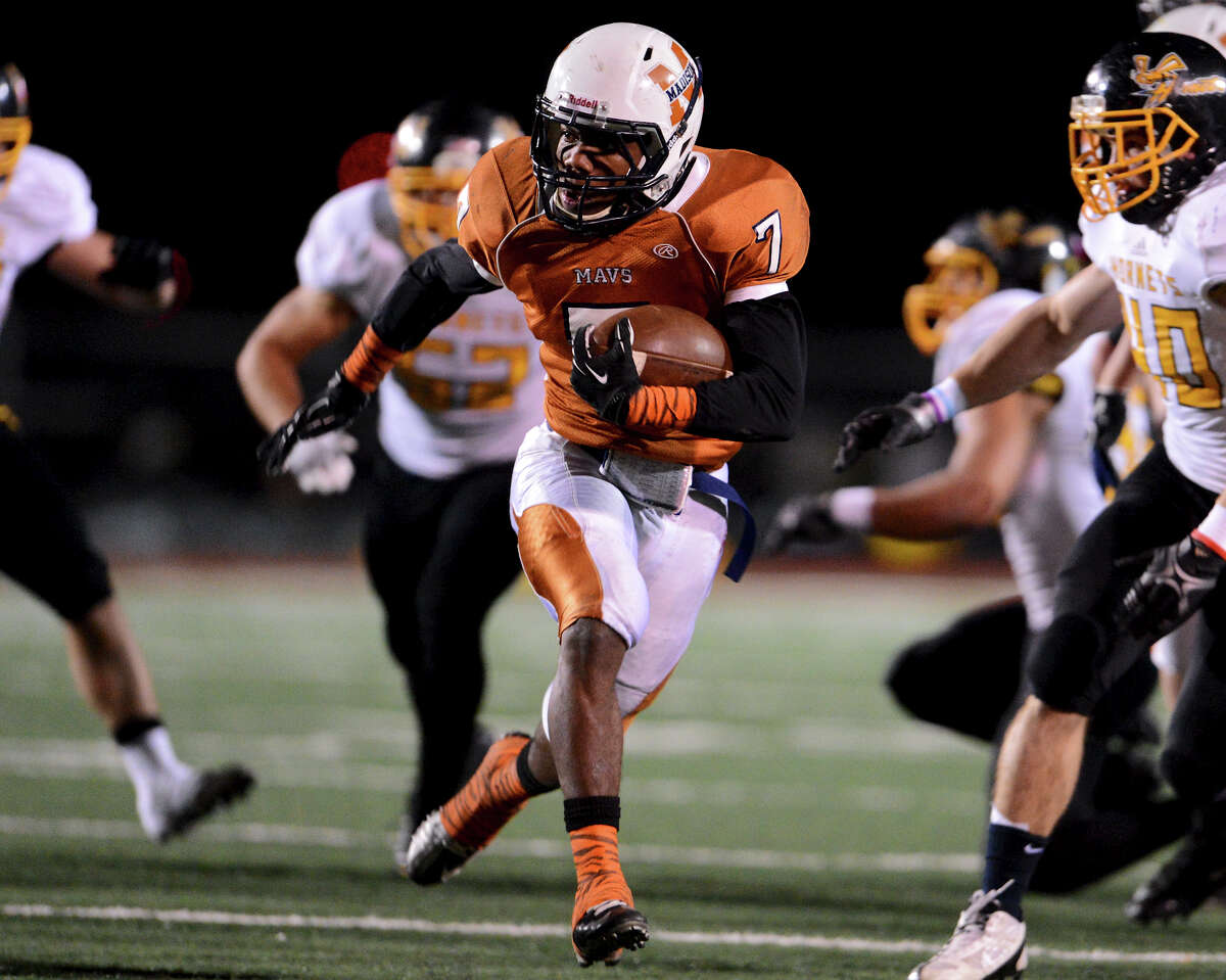 Madison's Marquis Warford (7) runs into the East Central secondary during a Class 5A Division I second round playoff game at Comalander Stadium in San Antonio, Friday, November 23, 2012. John Albright / Special to the Express-News.