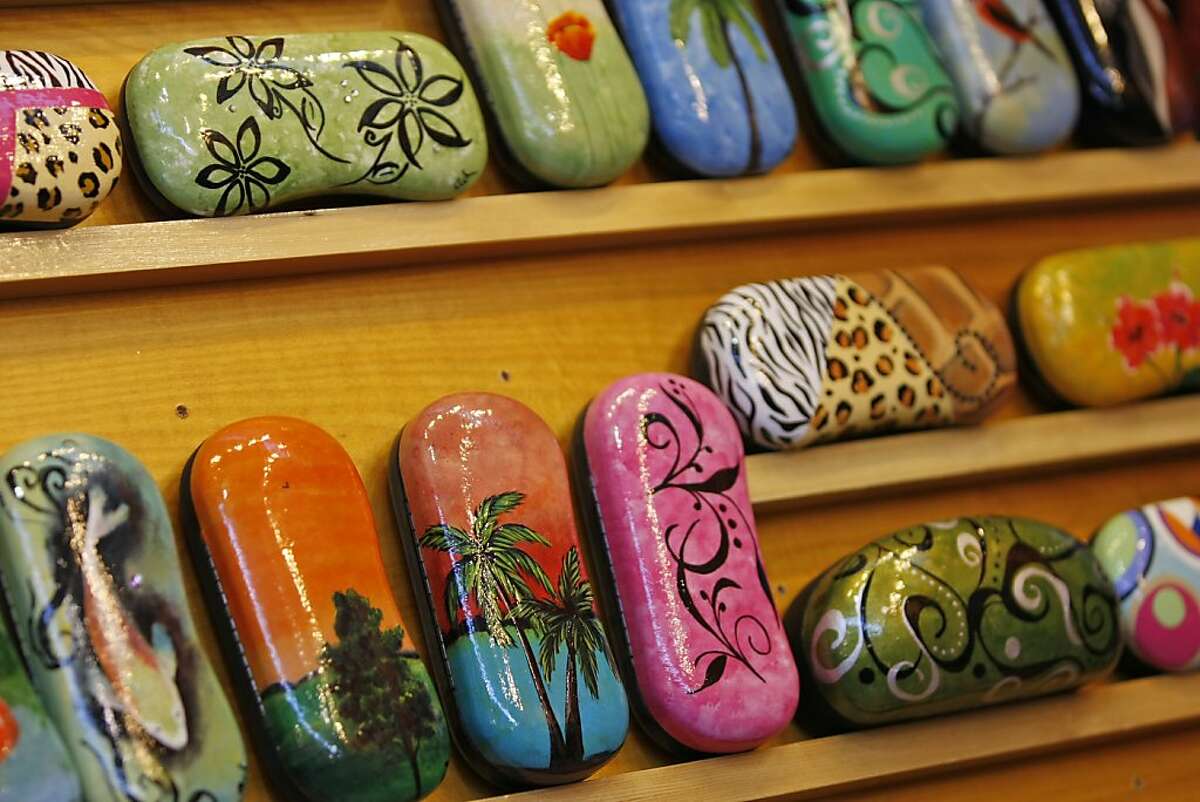 Angie Witt-Thompson's unique hand painted eyeglass leather cases are available for sale from her booth, ByAngie, at The Fort Mason Center in San Francisco, Calif. for the 34th annual Craftswomen Holiday fair. The works of female artists and craftwomen are being sold in a benefit for the city's Women's Building and its programs.