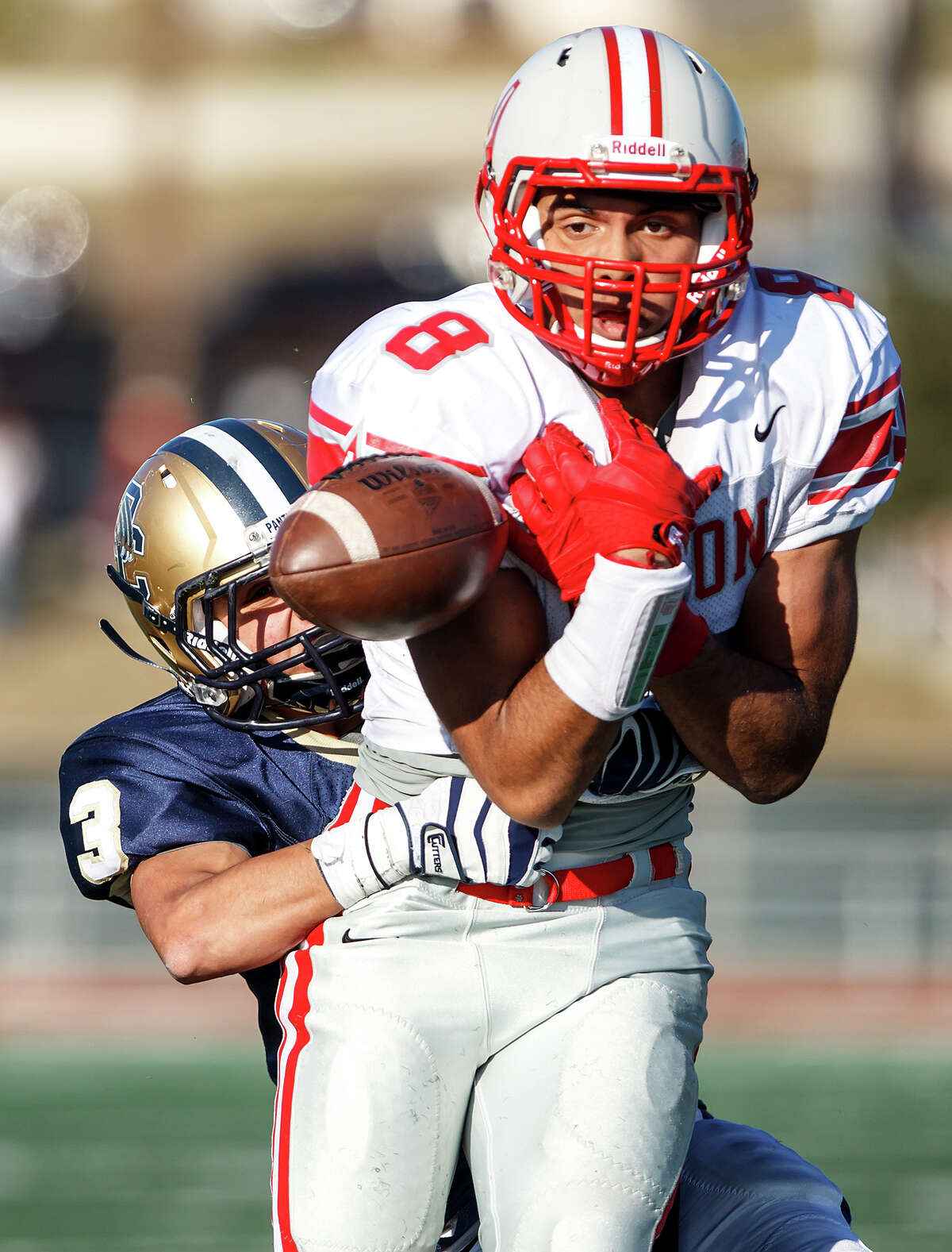 O'Connor's Eddie Vasquez wraps up Judson's Jermaine Adams, preventing him from catching the ball and ending the Rockets' final scoring change during the final minute of their Class 5A Division II second round playoff game at Comalander Stadium on Nov. 24, 2012. O'Connor held on to come away with a 34-28 victory over the Rockets. MARVIN PFEIFFER/ mpfeiffer@express-news.net