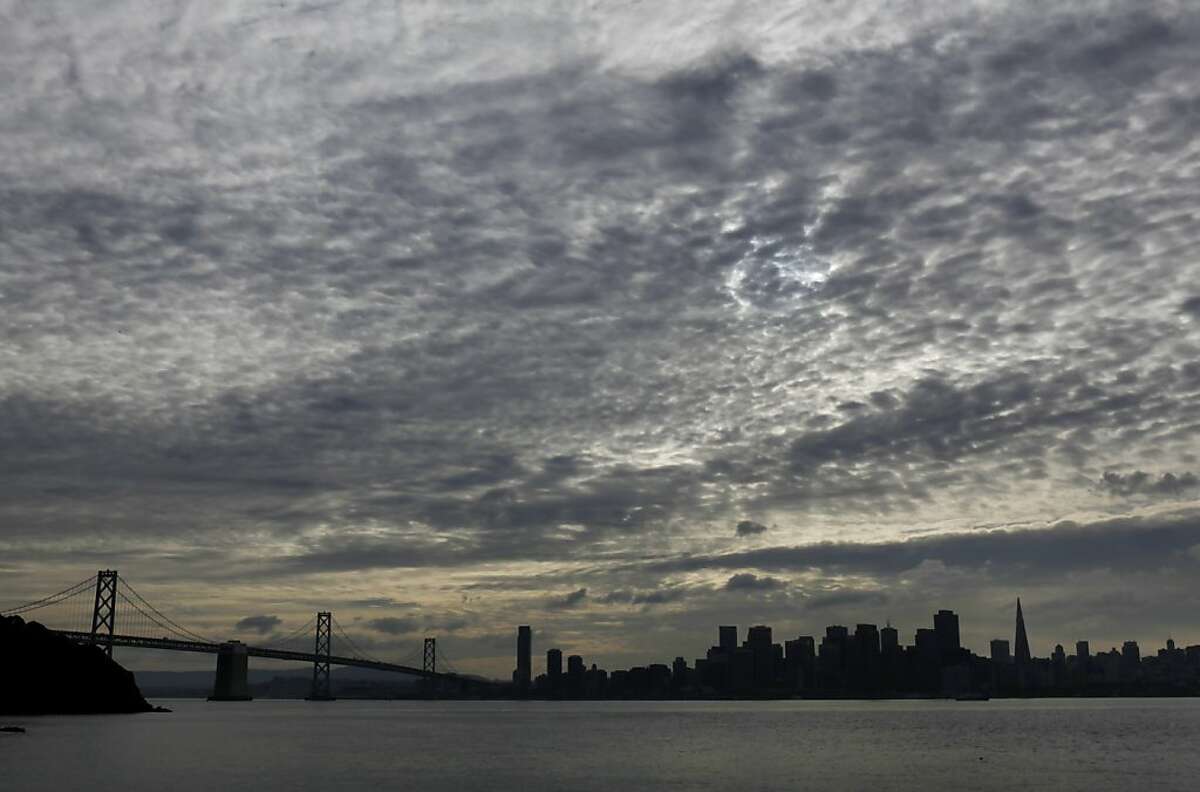 The San Francisco skyline and Bay Bridge are visible as the leading edge of an incoming storm works it way into the Bay Area on Tuesday, November 27, 2012. The San Francisco Bay Area will be hit by a series of storms starting Wednesday, that will last through Sunday, and could deliver several inches of rain to the region.