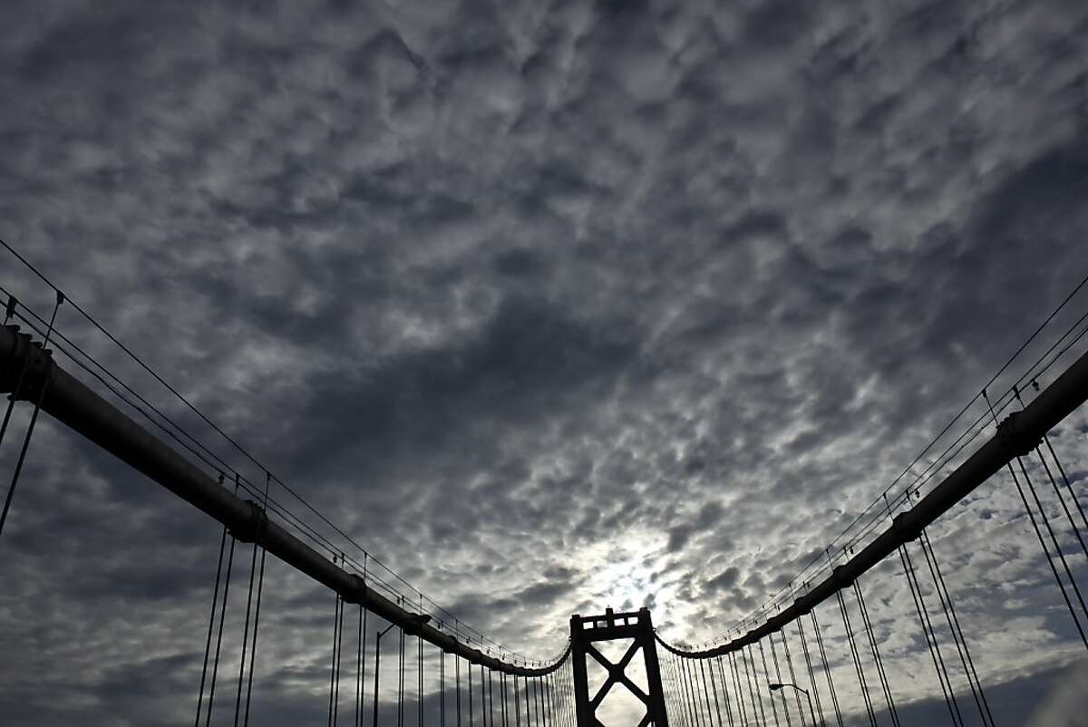 The middle tower of the western section of the Bay Bridge has a backdrop of storm clouds that are making their way across the region on Tuesday, November 27, 2012, in San Francisco, Calif. The San Francisco Bay Area will be hit by a series of storms starting Wednesday, that will last through Sunday, and could deliver several inches of rain to the region.