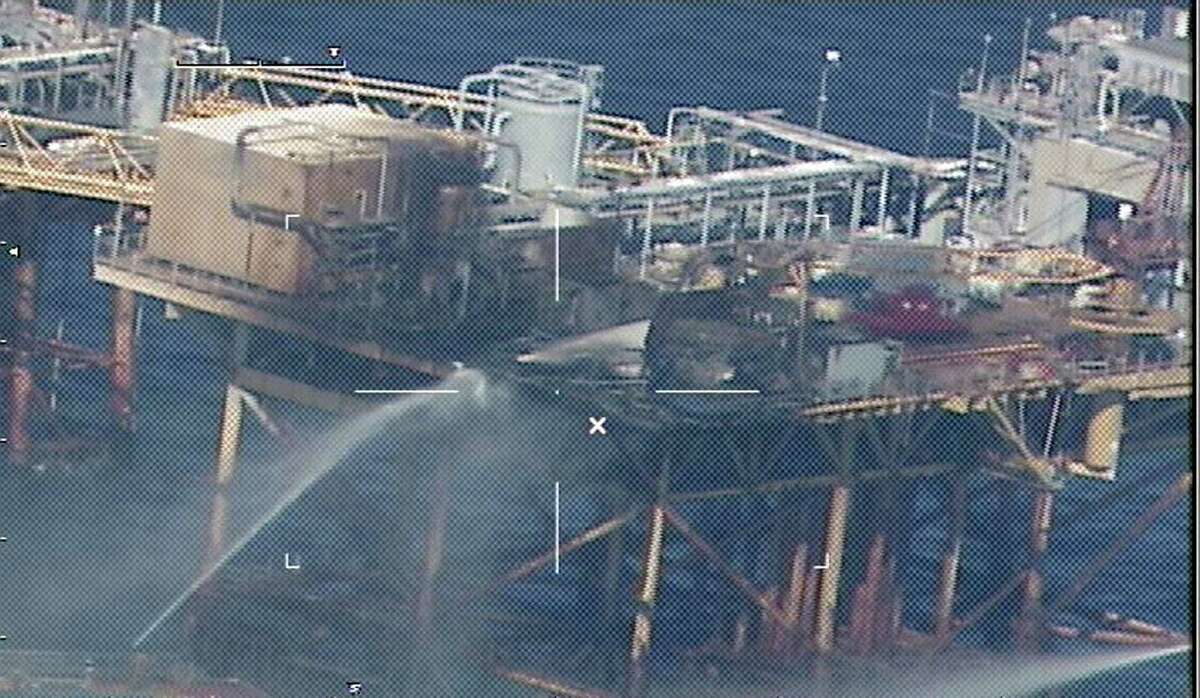 Commercial vessels spray water to extinguish a platform fire on board the West Delta 32 oil rig in the Gulf of Mexico off Grand Isle, Louisiana on November 16, 2012. There were 22 people on board when the blast rocked the rig operated by Houston-based Black Elk Energy shortly before 9 am (1500 GMT). Two workers have been missing since the accident. Divers hired by the owner of an oil rig that suffered an explosion and fire in the Gulf of Mexico found one body late Saturday, the Coast Guard said. AFP PHOTO / HNADOUT / US COAST GUARD = RESTRICTED TO EDITORIAL USE - MANDATORY CREDIT " AFP PHOTO / US COAST GUARD " - NO MARKETING NO ADVERTISING CAMPAIGNS - DISTRIBUTED AS A SERVICE TO CLIENTS =HO/AFP/Getty Images
