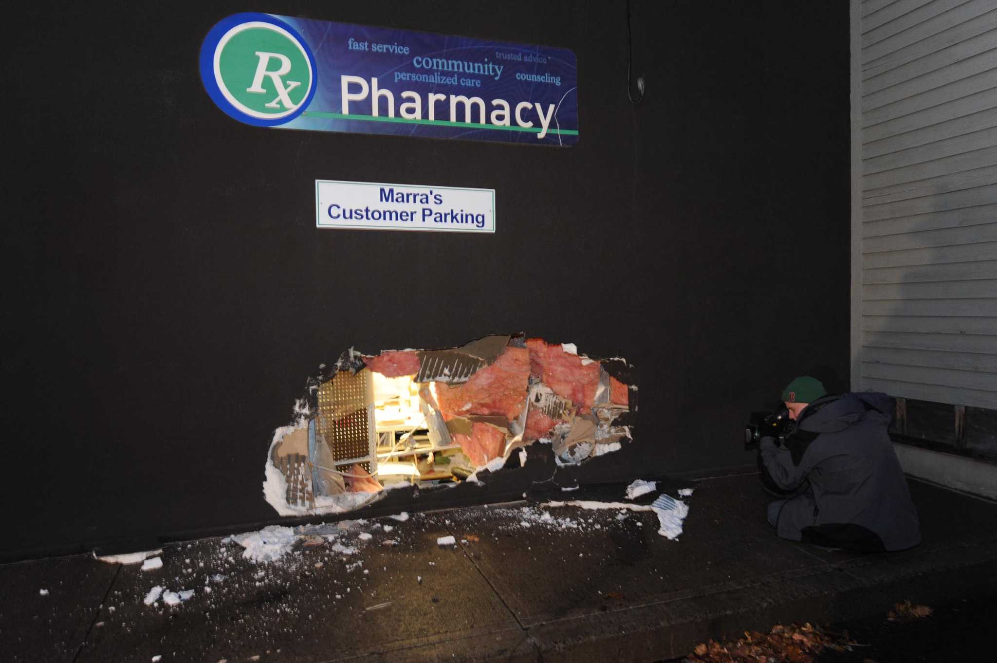 Car hits drugstore