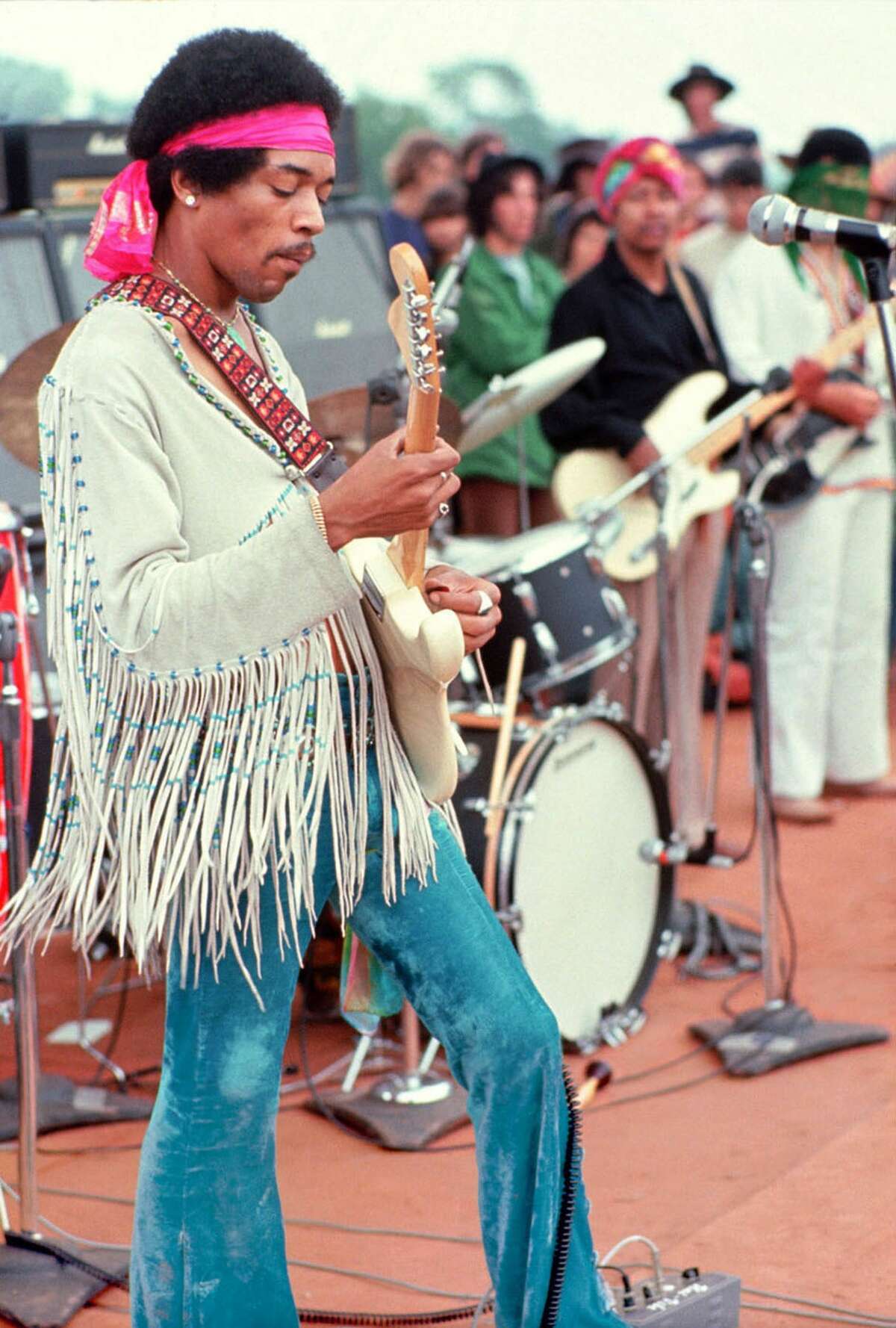 (FILES) This handout file photo by Henry Diltz shows musician Jimi Hendrix playing live at the original Woodstock festival in Bethel, New York on August 15, 1969. Hendrix's relatively short stage career with his band The Experience lasted only four years, but his musical legacy was huge, on September 18, 2010 people the world over are preparing to mark the fortieth anniversary of the death of the guitar hero who died on September 18, 2010 in london hotel room after choking on his own vomit after a lethal cocktail of Red wine and sleeping pills. AFP PHOTO/HENRY DILTZ/MORRISON HOTEL GALLERY/NEWSCOM/HO ++RESTRICTED TO EDITORIAL USE++ (Photo credit should read HENRY DILTZ/AFP/Getty Images)