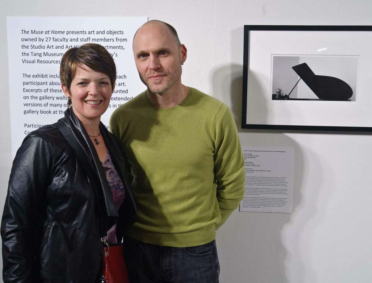 Opening reception shot of Shana and Robert ParkeHarrison with a photograph of Igor Stravinsky by Arnold Newman. (Courtesy Skidmore College)