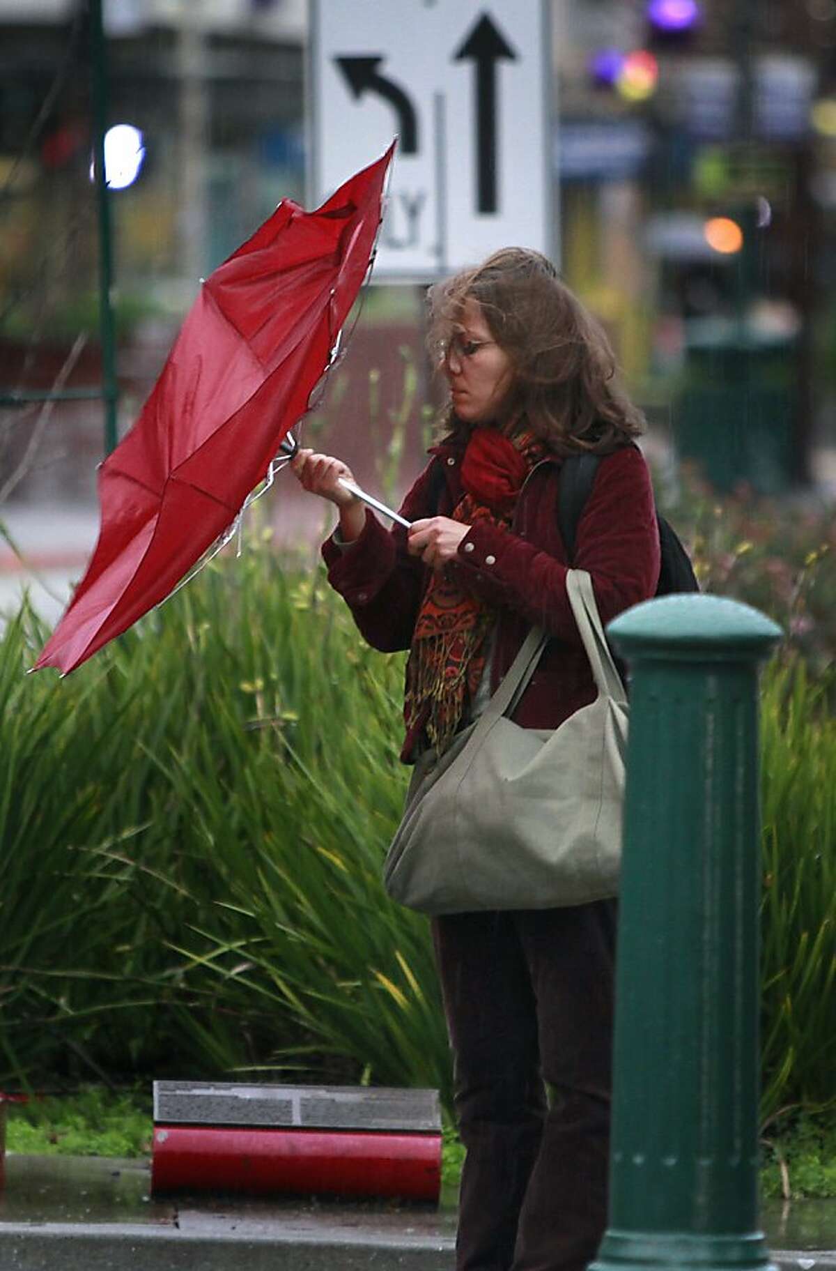 A pedestrian fights a losing battle against the wind in Berkeley, Calif. on Wednesday, Nov. 28, 2012.