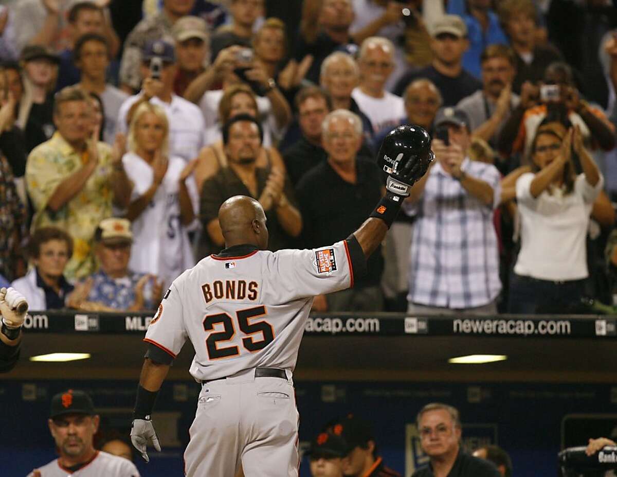 Fans over the Giants dugout give San Francisco Giants Barry Bonds a standing ovation as he left the game in the 8th inning. The San Diego Padres host the San Francisco Giants at Petco Park in San Diego on Saturday, August 4, 2007. Photo taken on 8/4/07 in San Diego, CA Photo by Michael Maloney / San Francisco Chronicle ***Roster/code replacement Ran on: 08-05-2007 On the fourth pitch of his first at-bat, Bonds hit the ball into the left-field seats. The crowd jumped up and cheered, though there were a few boos. Ran on: 08-05-2007 On the fourth pitch of his first at-bat, Bonds hit the ball into the left-field seats. The crowd jumped up and cheered, though there were a few boos. Ran on: 08-05-2007 On the fourth pitch of his first at-bat, Barry Bonds hits the ball into the left-field seats. Many fans jumped up and cheered, though some booed.
