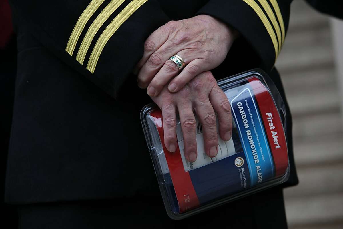 San Francisco Fire Marshal Thomas Harvey holds a carbon monoxide alarm as he speaks during a press conference on Thursday, November 29, 2012 in San Francisco, Calif.