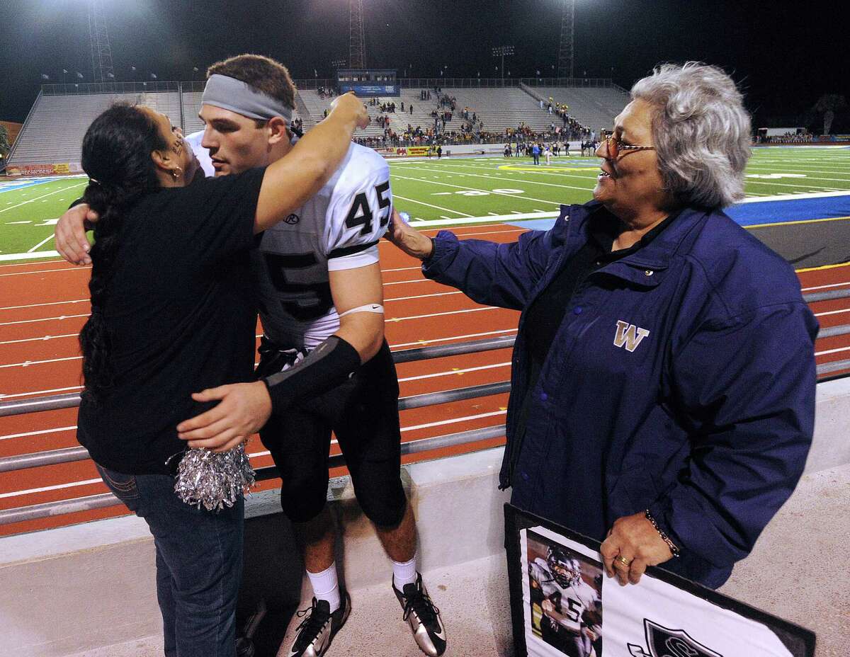Linebacker Garth Tubbs of Steele High School is greeted by his mother, Jessica Razo, left, and grandmother, Tina Razo, after Steele defeated Edinburg North, 38-0 to advance in Class 5A Division II football playoffs in Kingsville on Saturday, Dec. 1, 2012.