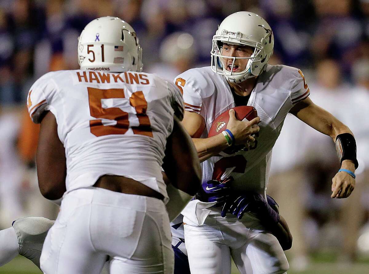 Texas quarterback Case McCoy (6) is sacked by Kansas State defensive end Meshak Williams during the first half of an NCAA college football game Saturday, Dec. 1, 2012, in Manhattan, Kan. (AP Photo/Charlie Riedel)