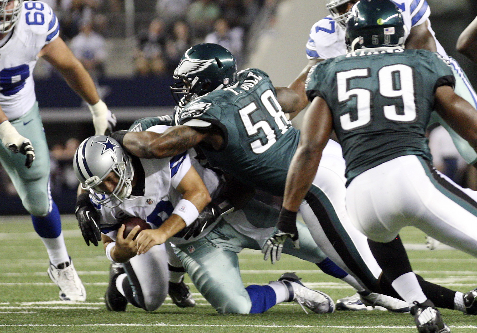 Philadelphia Eagles defensive back Curtis Marsh (31) celebrates his tackle  with teammate Brandon Hughes (27) during the second half of an NFL football  game against the Dallas Cowboys on Saturday, Dec. 24