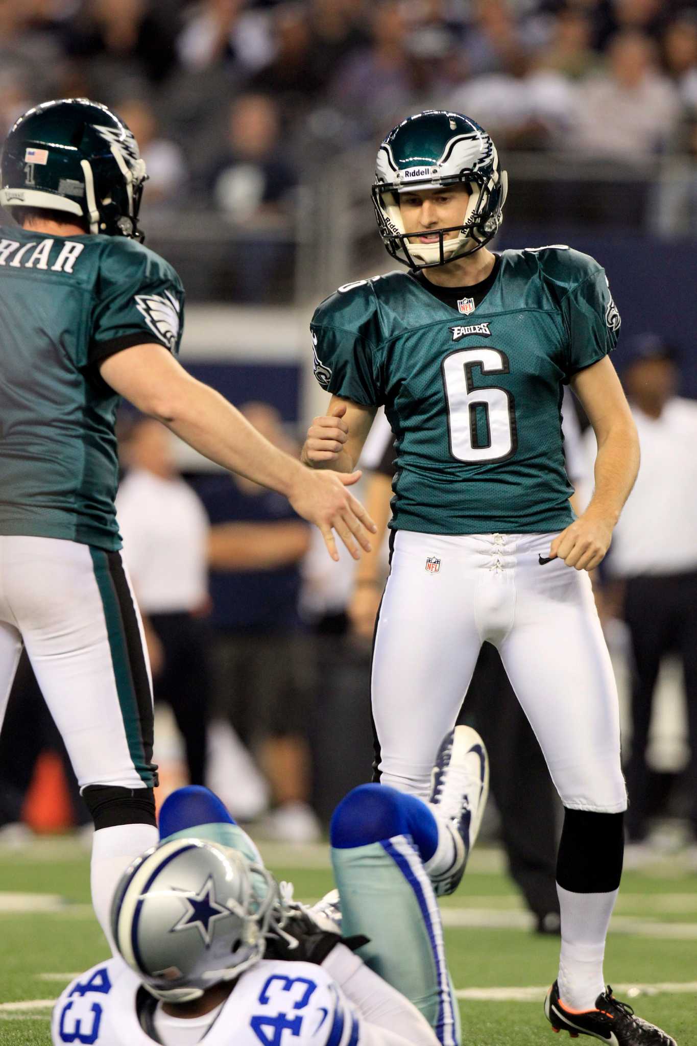 Philadelphia Eagles defensive back Curtis Marsh (31) celebrates his tackle  with teammate Brandon Hughes (27) during the second half of an NFL football  game against the Dallas Cowboys on Saturday, Dec. 24