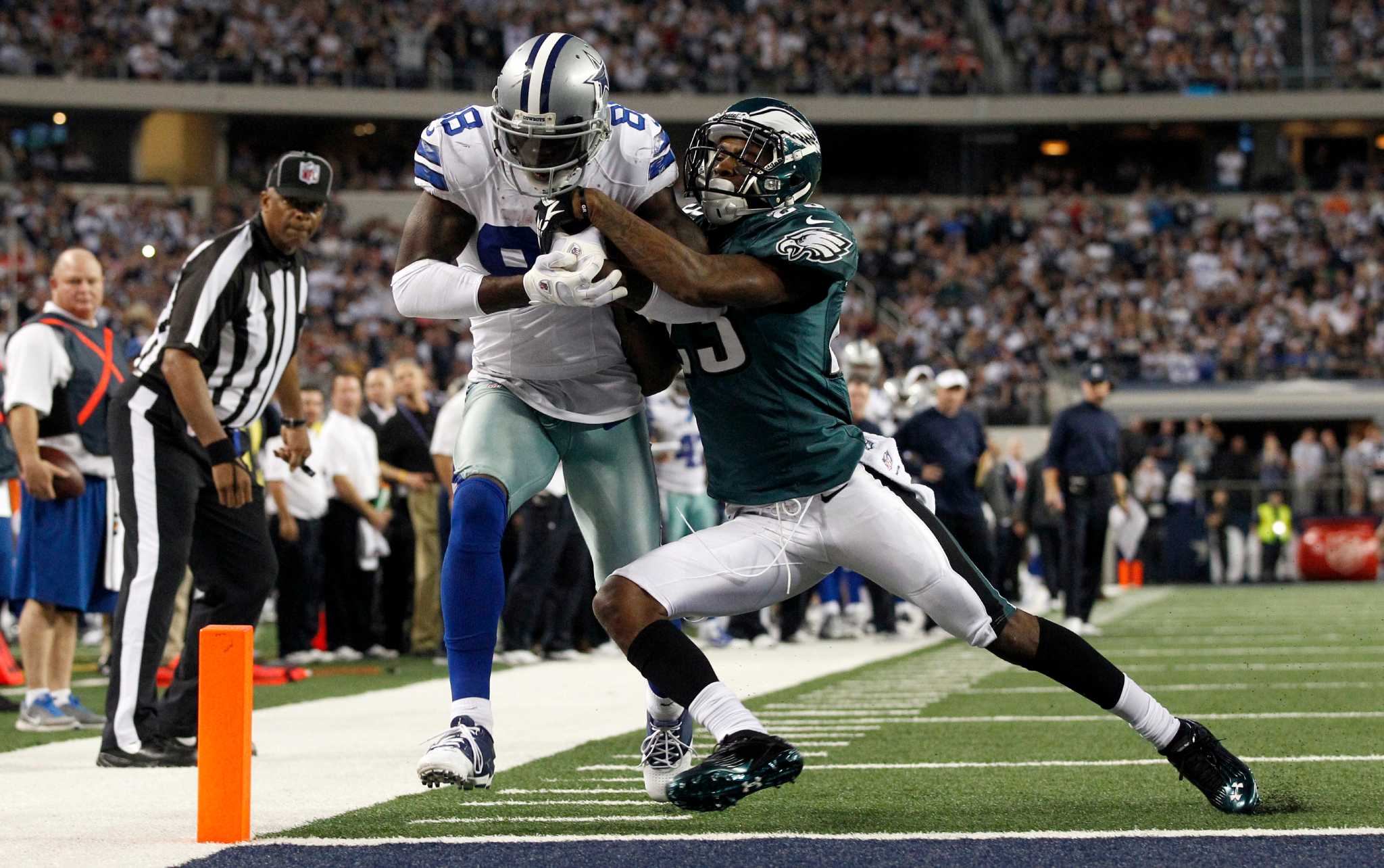 Philadelphia Eagles defensive back Curtis Marsh (31) celebrates his tackle  with teammate Brandon Hughes (27) during the second half of an NFL football  game against the Dallas Cowboys on Saturday, Dec. 24