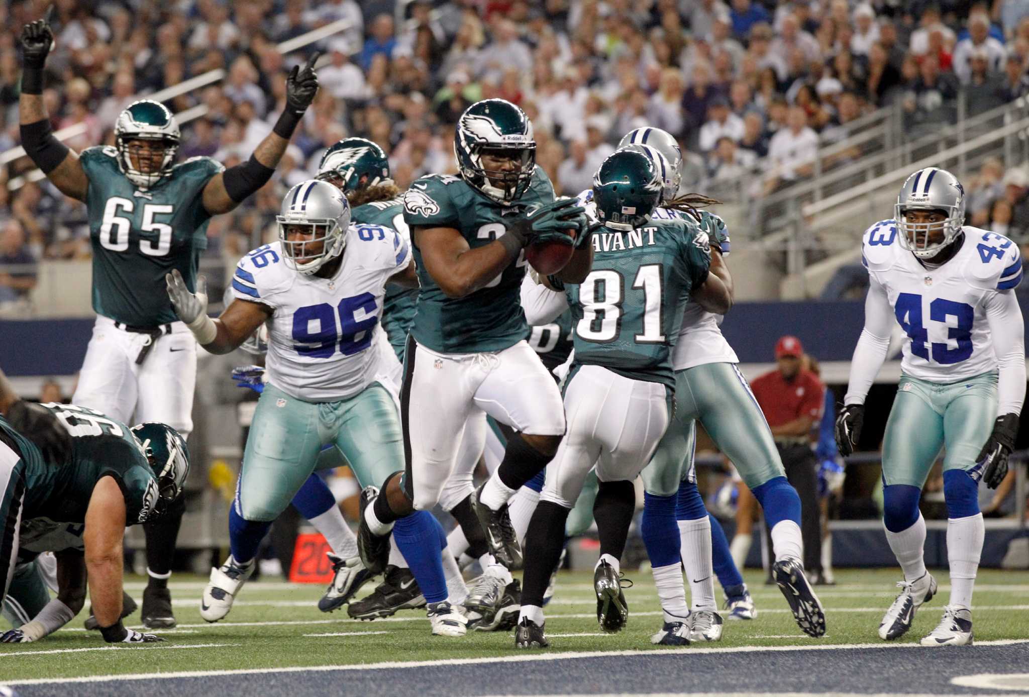 Philadelphia Eagles defensive back Curtis Marsh (31) celebrates his tackle  with teammate Brandon Hughes (27) during the second half of an NFL football  game against the Dallas Cowboys on Saturday, Dec. 24