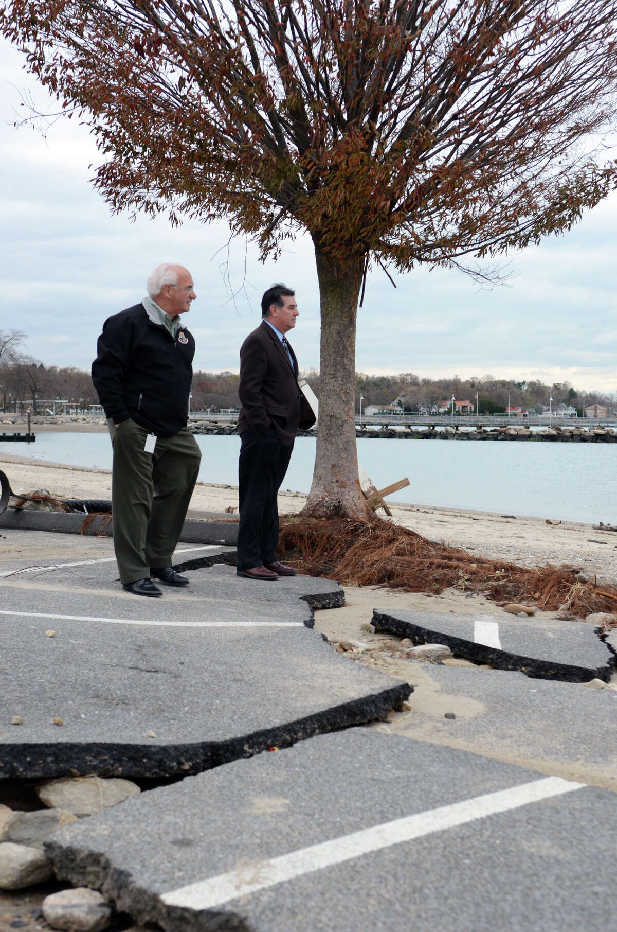 Stamford Mayor Michael Pavia and Director of Operations Ernie Orgera survey the damage to West Beach in Stamford on Thursday, Nov. 1, 2012. A city planner is working to partner with Columbia University graduate students this spring to consider ways to shield shorelines in city parks from fierce storms.