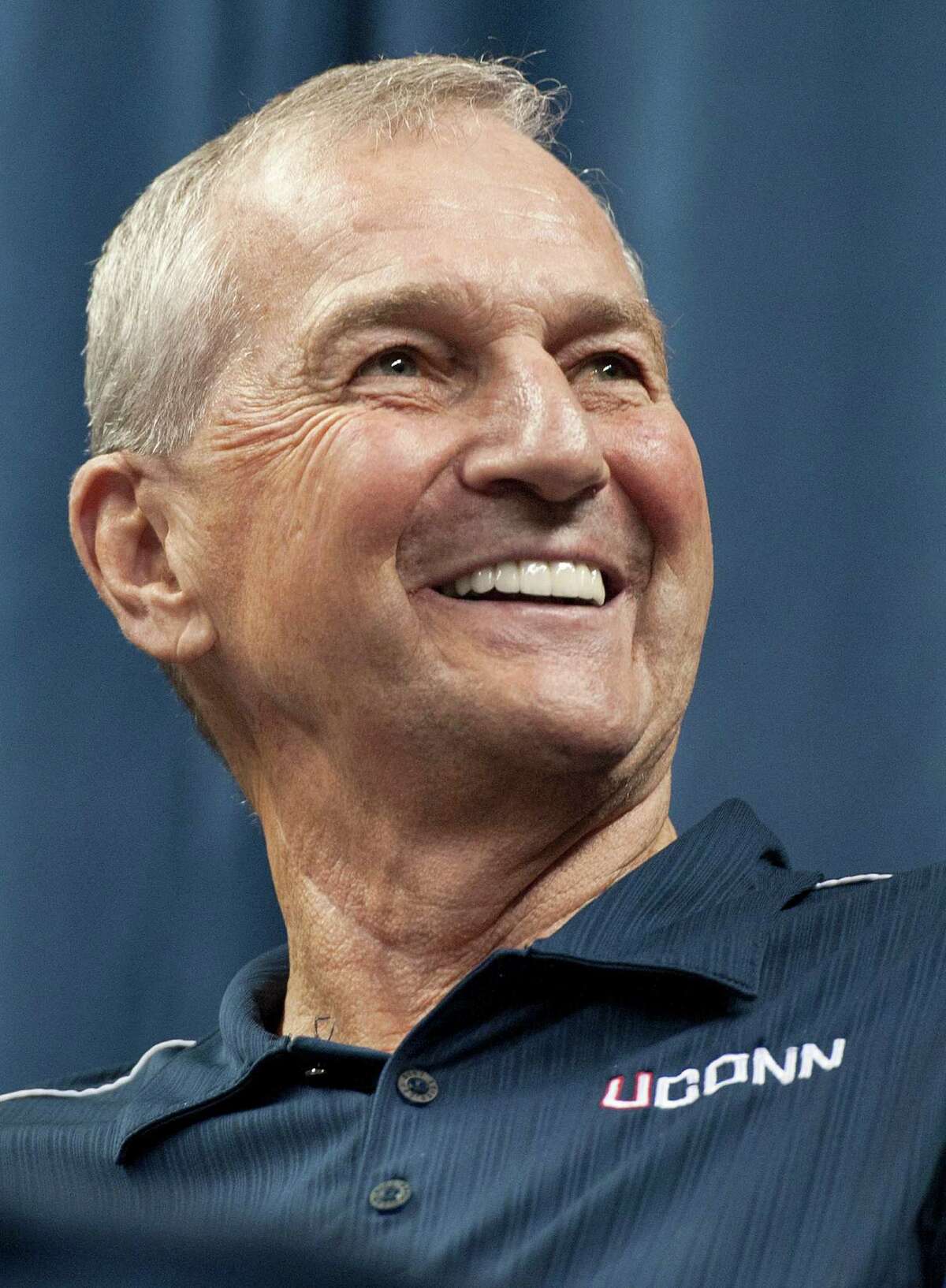 Connecticut head coach Jim Calhoun smiles during a news conference to announce his retirement in Storrs, Conn., Thursday, Sept. 13, 2012. The 70-year-old Hall of Famer ran the men's program for 26 years and won three national titles. Assistant coach Kevin Ollie, who played for Calhoun and was his hand-picked successor, will be introduced as the Huskies' new coach. The person familiar with the deal said Ollie will receive a one-year contract. (AP Photo/Jessica Hill)