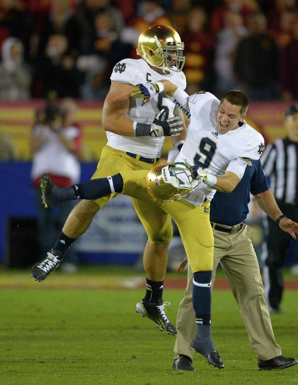 BEST: BCS national championship game (Alabama vs. Notre Dame, Jan. 7) -- What could be better than two tradition-steeped rivals playing for all of the credit cards, as Brent Musburger will say? Notre Dame linebacker Manti Te'o (left) celebrates with Notre Dame wide receiver Robby Toma in the closing second of their victory over USC on Nov. 24, 2012. Mark J. Terrill/Associated Press