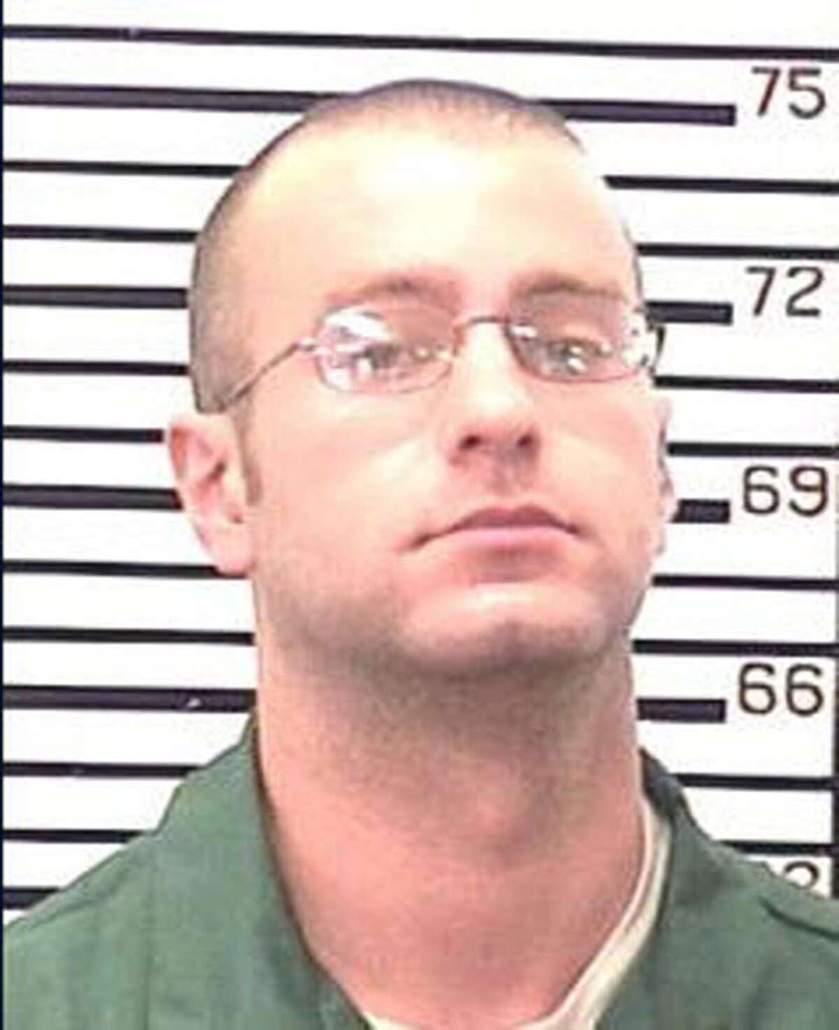 Christopher Porco, 28, pictured here in a prison mugshot taken at state prison in November 2009.