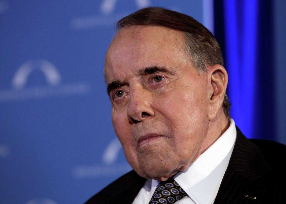 FILE - In this March 21, 2012, file photo, former Senate Majority Leader Bob Dole looks to the stage during an event honoring Dole and Howard Baker at Mellon Auditorium in Washington. Dole has checked himself into Walter Reed Army Medical Center for what his spokesman said on Monday, Nov. 27, 2012, was a routine procedure. Dole spokeswoman Marion Watkins says the 89-year-old Dole is "doing very well" and is expected to leave the hospital Wednesday. (AP Photo/Carolyn Kaster, File)