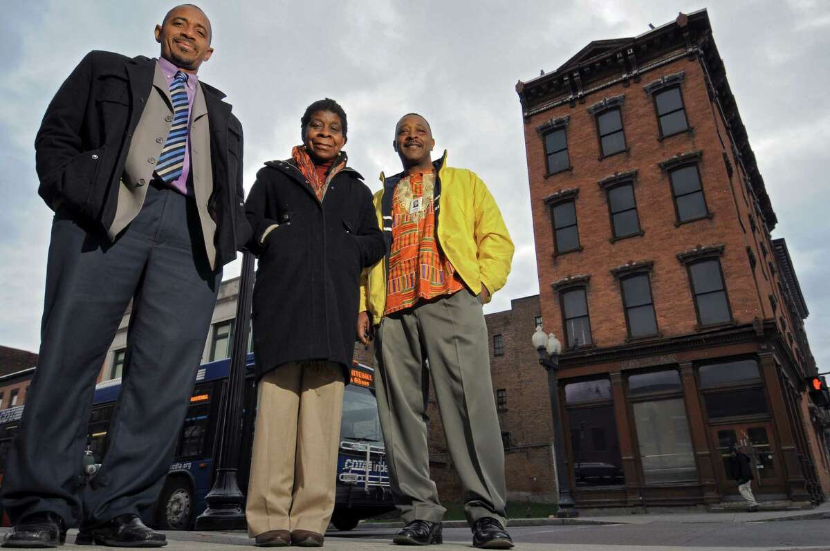 Mark Bobb-Semple, left, Alice Green, center, and Willie White stand across from the former bank building that will house the African-American Cultural Center of the Capital Region,at the corner of Madison Avenue and South Pearl Streets, seen here on Thursday March 29, 2012 in Albany, NY. (Philip Kamrass / Times Union )