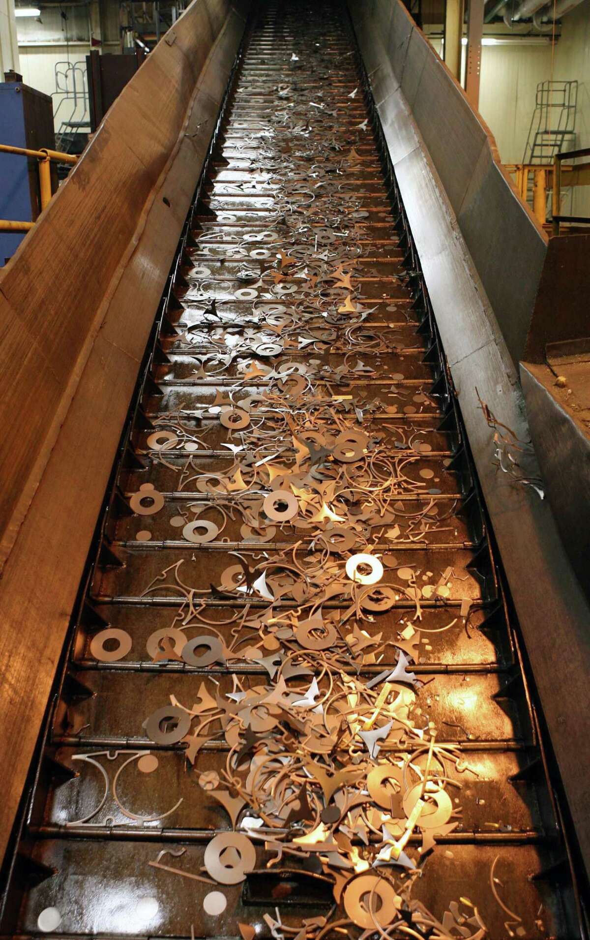 Metal scraps were moved along a conveyor belt for recycling at the General Motors Transmission Plant in Warren, Mich., in 2008.