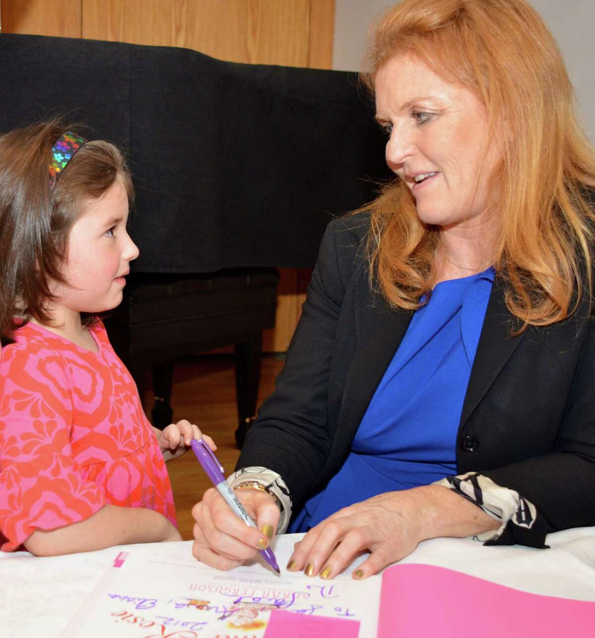 "My name is Sara, too!" 6-year-old Sara Reiter sweetly told Sarah Ferguson, the Duchess of York, on Sunday at the New Canaan Library. Dec. 2, 2012.