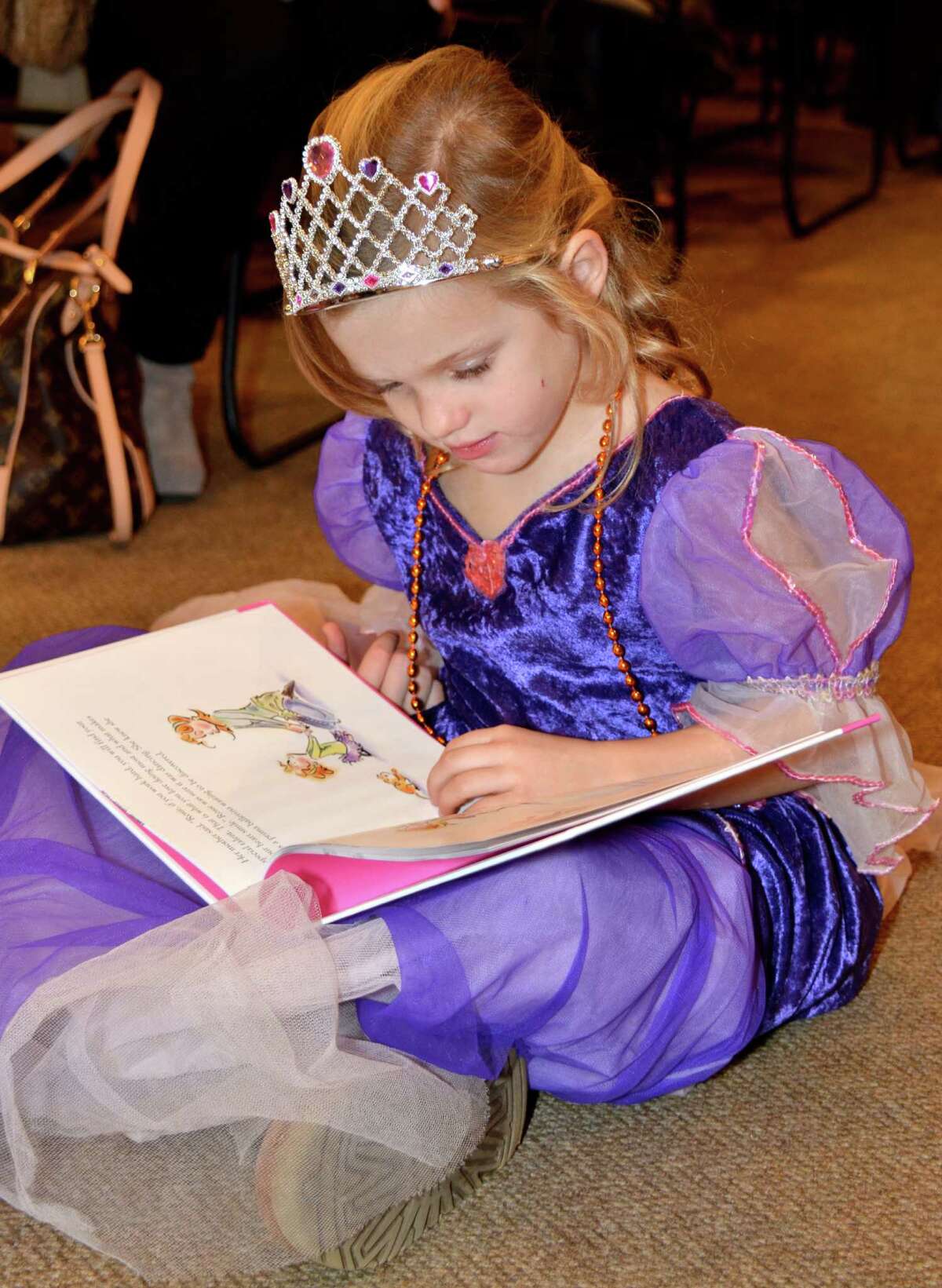 Four-year-old Anissa Mullen, born in England herself, patiently awaits the arrival of Sarah Ferguson, the Duchess of York, to sign her new book, "Ballerina Rosie," at the New Canaan Library on Sunday. Dec. 2, 2012.