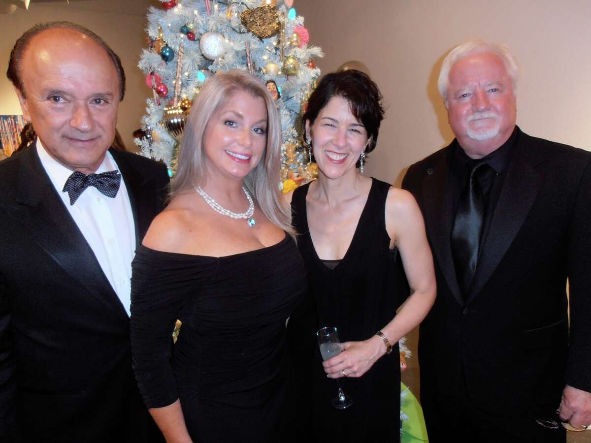At the Blue Starry Night gala, Humberto Salda–a, from left, Caprice Taylor, new Artpace Executive Director Amada Cruz and Blue Star President Bill Fitzgibbons gather to admire artist-decorated trees.