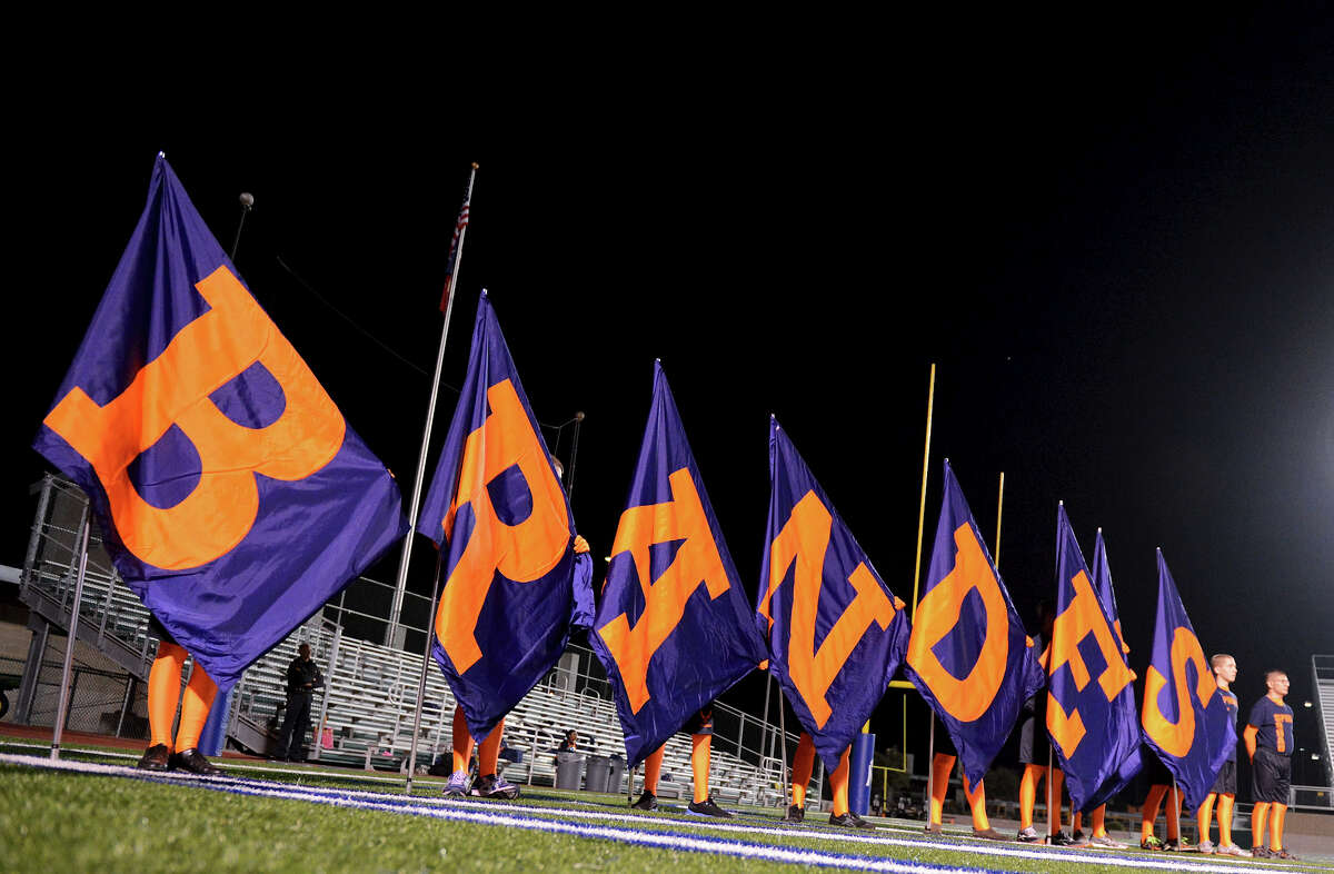 Brandeis spirit members hold flags during a NISD three school football playoff pep rally for Brandeis, Brennan and O'Connor at Farris Stadium in San Antonio, Thursday, December 6, 2012. John Albright / Special to the Express-News.