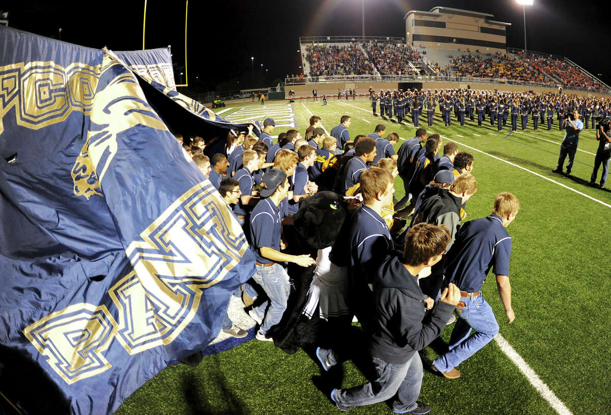The O'Connor varsity football team walks onto the field during a NISD three school football playoff pep rally for Brandeis, Brennan and O'Connor at Farris Stadium in San Antonio, Thursday, December 6, 2012. John Albright / Special to the Express-News.