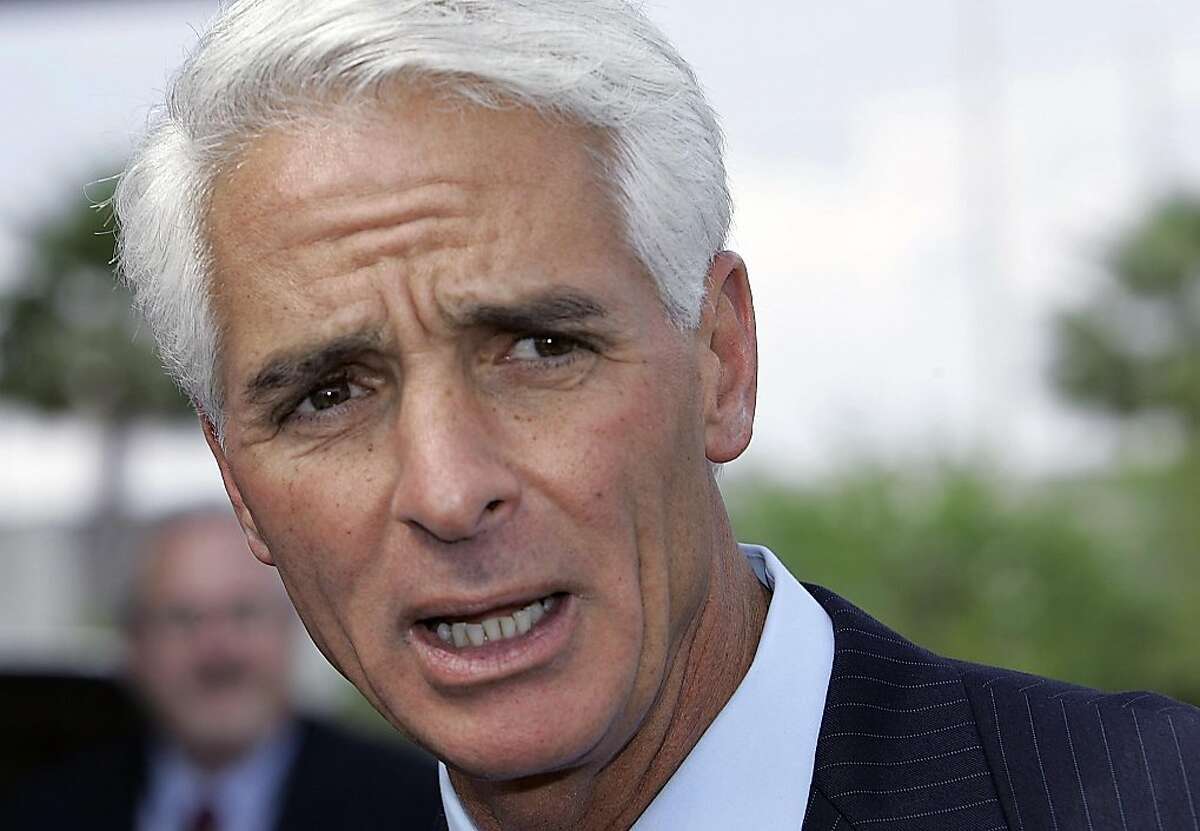 FILE - In this April 5, 2007 file photo, Florida Gov. Charlie Crist talks to the media at the Miami airport, about the plan to restore voting and other civil rights to felons who have finished their sentences. Former Florida Gov. Charlie Crist has announced on Twitter that he's joining the Democratic Party, Friday, Dec. 7, 2012. (AP Photo/Alan Diaz, File)