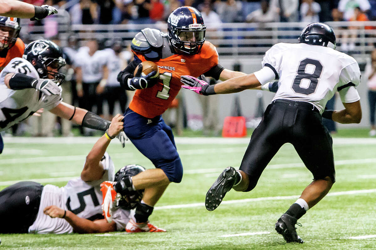 Brandeis's Trinton Ynclan (center) fights towards the goal line as Steele's John Burton (from right), Mason Martinez and Garth Tubbs close in during the third quarter of their Class 5A Division II state quarterfinal game at the Alamodome on Dec. 8, 2012. Steele won the game 28-12. MARVIN PFEIFFER/ mpfeiffer@express-news.net