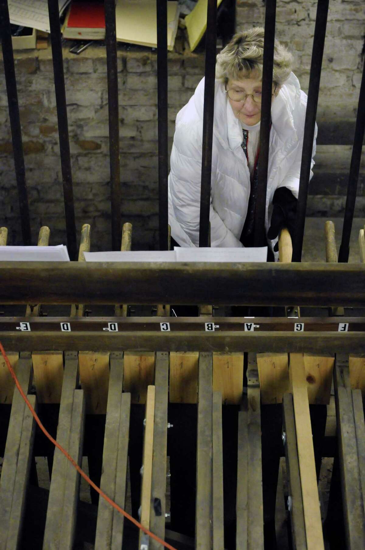 Gayle Walrath plays the restored 19th-century Meneely bells at the Cathedral of the Immaculate Conception in Albany, NY Saturday Dec. 8, 2012. (Michael P. Farrell/Times Union)