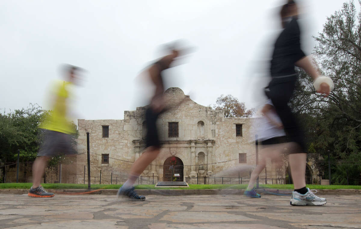 FOR METRO - Runners participate in a River City Run, a 5K course through the heart of downtown with informative stops at historic locations along the way, at the Alamo on Sunday, Dec. 9, 2012. MICHAEL MILLER / FOR THE EXPRESS-NEWS
