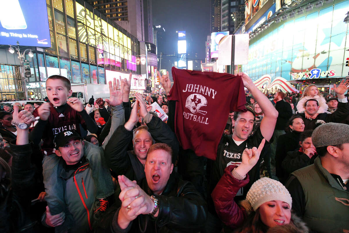 Texas A&M fans celebrate in Times Square as Texas A&M's quarterback Johnny Manziel wins the Heisman Trophy Saturday Dec. 8, 2012 in New York, New York.