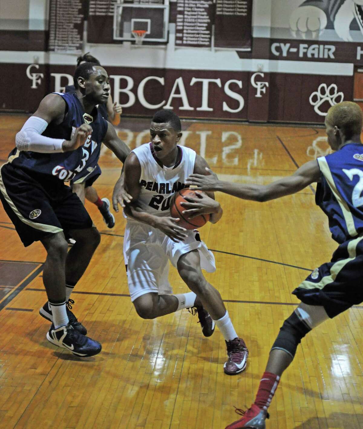 Pearland junior Devon Bagley (20) drove to the hoop earlier this year against Klein Collins.