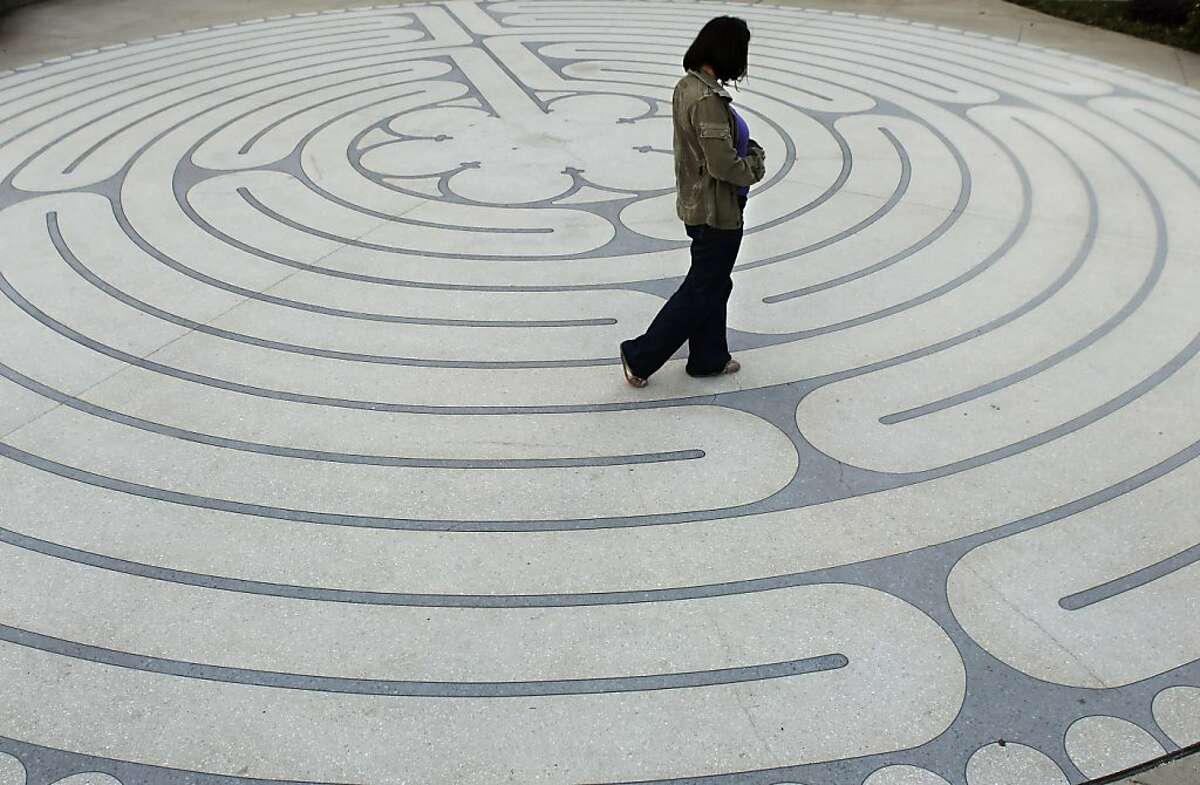 René Fay regularly walks the labyrinth outside Grace Cathedral to relax and meditate. She is seen here on Monday, December 10, 2012, on San Francisco, Calif., walking the path.