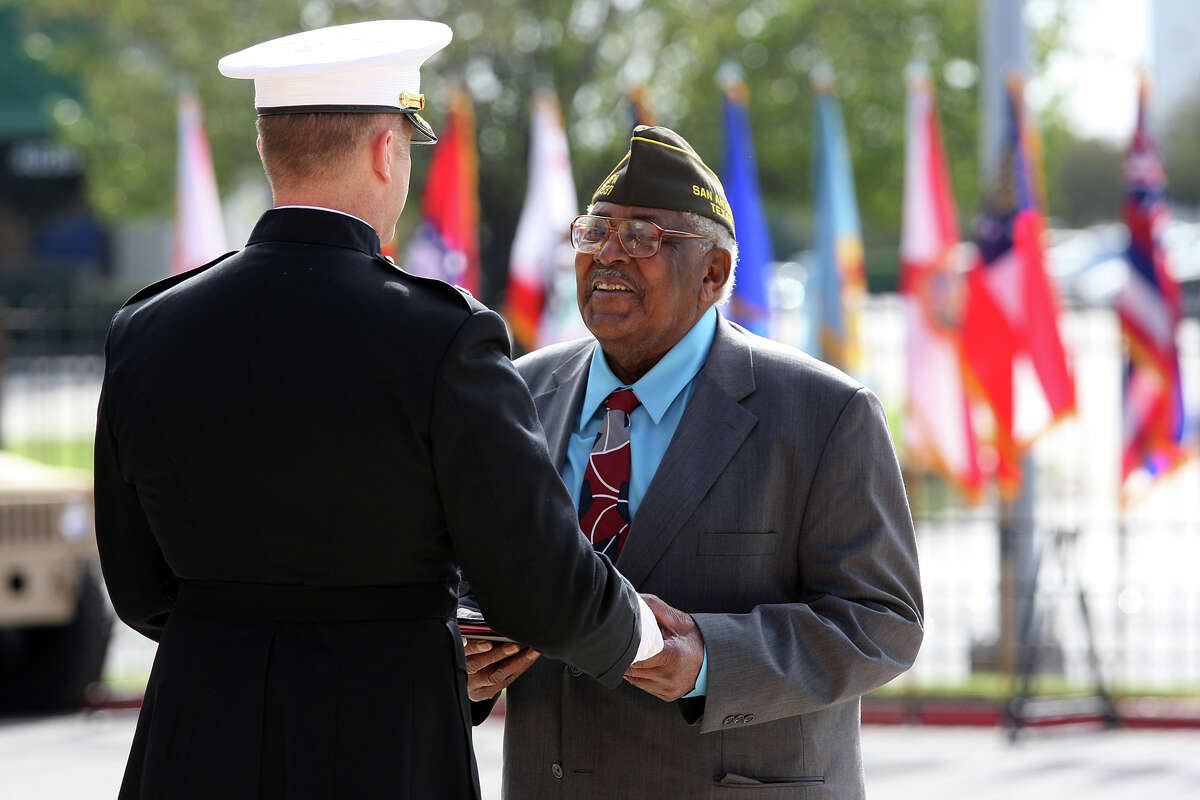 World War II veteran Calvin Curtis, 87, receives the Congressional Gold Medal from Marine Lt. Col. Bruce Sotire during a ceremony at Fort Sam Houston.