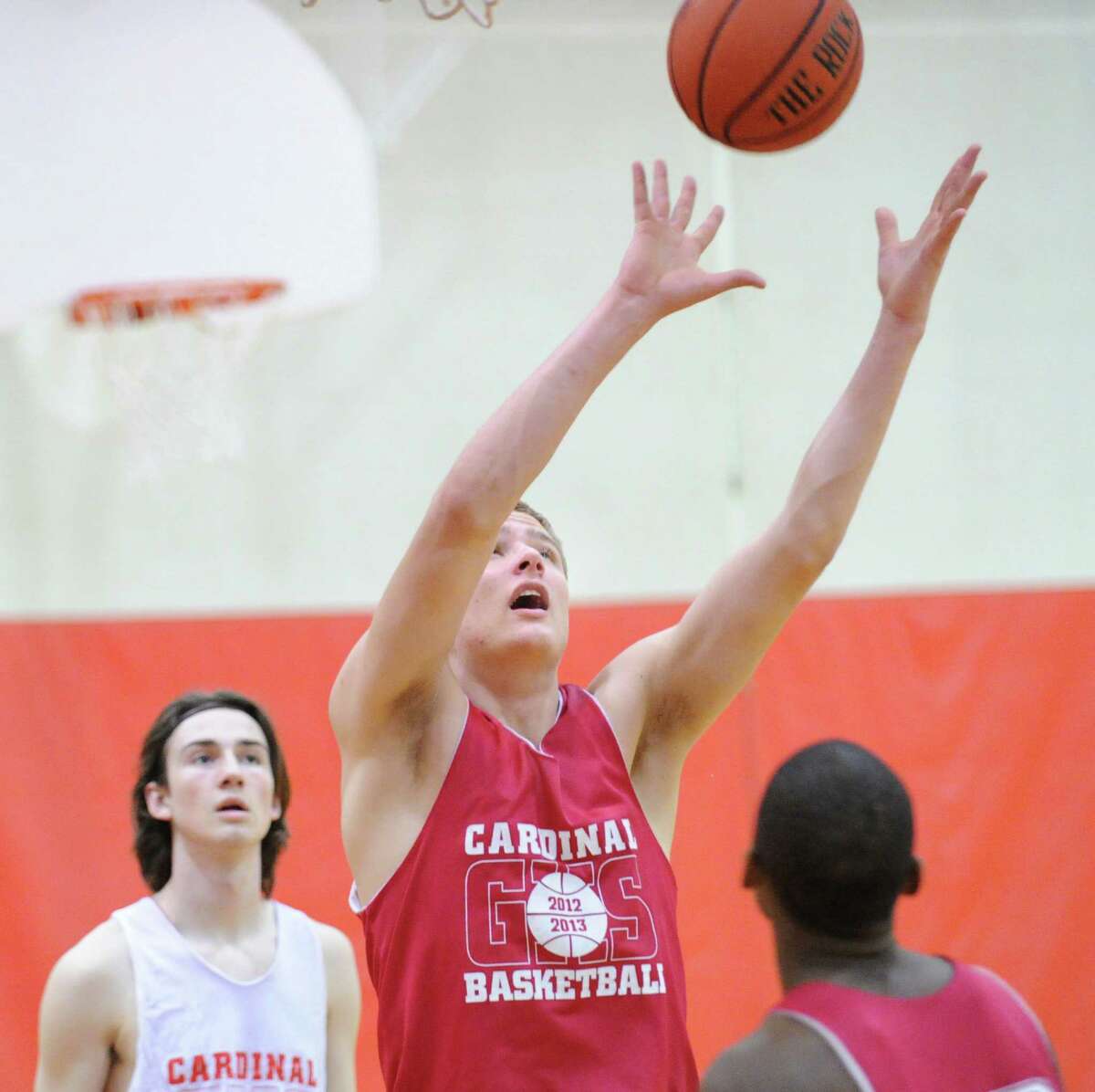 Alex Wolf, a 6-foot-9-inch junior, grabs a rebound during Greenwich High School boys basketball practice at the school, Tuesday afternoon, Dec. 11, 2012.