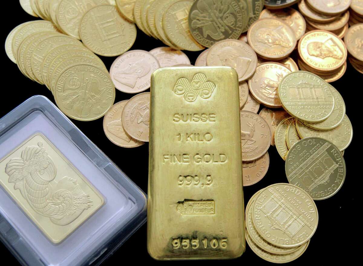 In this March 13, 2008 file photo, gold coins and bars are shown at California Numismatic Investments in Inglewood, Calif.