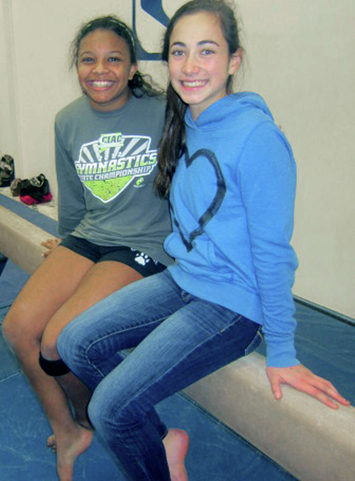 Green Wave juniors Ashley O'Berry, left, and Alison Profeta share the captaincy for New Milford High School gymnastics this season. December 2012 ,