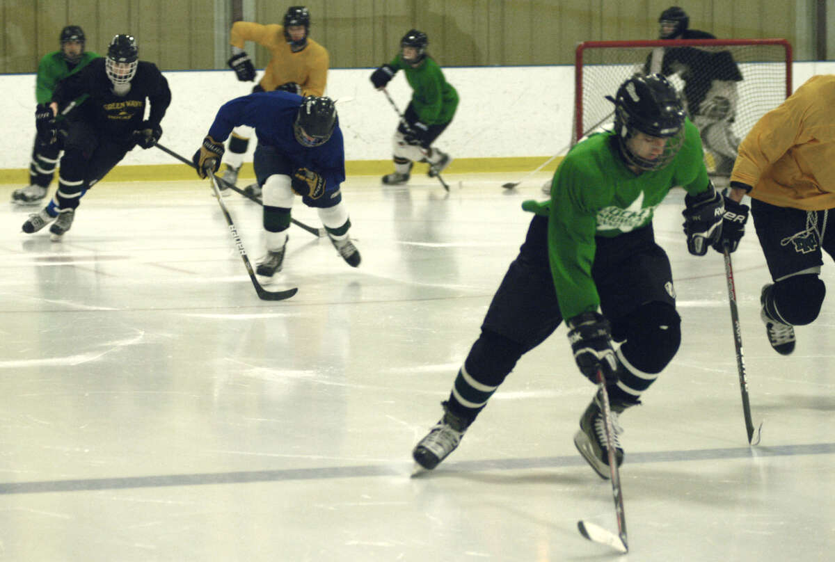 The Green Wave warms up for a pre-season practice at the Canterbury School's Draddy Arena in preparation for the New Milford High School ice hockey season. December 2012