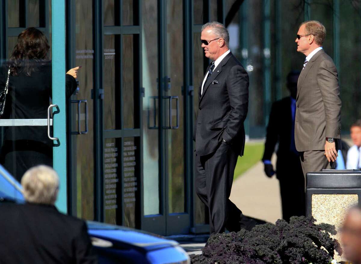 Dallas Cowboys Executive Vice President and Chief Operating Officer Stephen Jones, left, and Jerry Jones Jr., right, Executive Vice President of Sales and Marketing arrive at a memorial service for practice squad member Jerry Brown at Oak Cliff Bible Fellowship Tuesday, Dec. 11, 2012, in Dallas. (AP Photo/LM Otero)