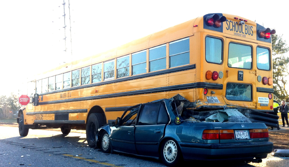 Crash with school bus kills 1, no students hurt