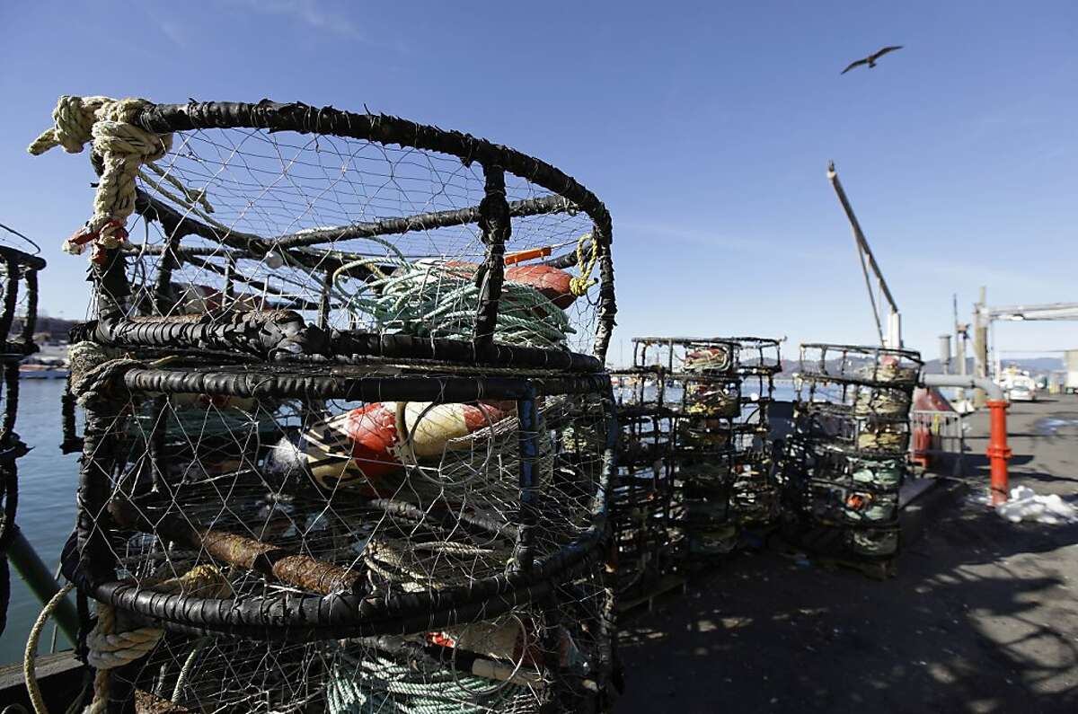 Empty crab pots sit stacked along a pier at Fisherman's Wharf in San Francisco, Monday, Dec. 10, 2012. Dungeness crab boats in the fishing ports of San Francisco, Half Moon Bay and Bodega Bay were idle for several days because of a price dispute.