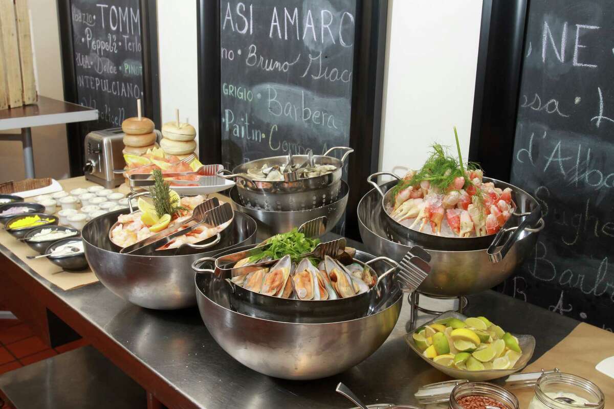 (For the Chronicle/Gary Fountain, November 18, 2012) The seafood station of the brunch at Quattro, the fine dining room at the Four Seasons Hotel.