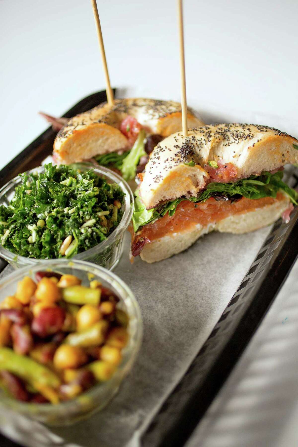 A house smoked salmon sandwich with a side of tuscan kale and four bean is seen, Friday, November 30, 2012, at Local Foods restaurant in Houston, Texas. (TODD SPOTH FOR THE CHRONICLE)