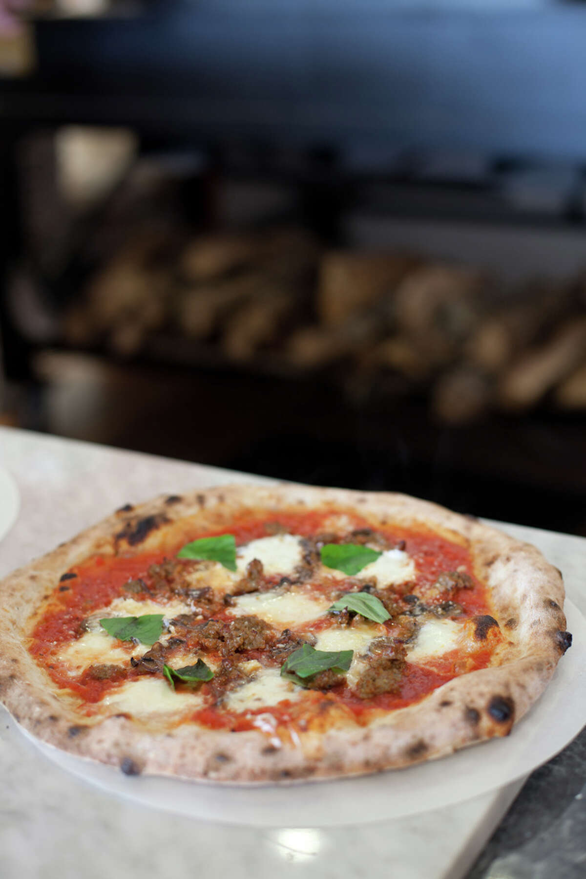 A pizza just out of the wood-fired oven at Pizaro's Pizza.