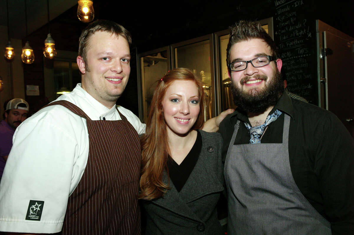 OTS/HEIDBRINK - Chef/co owner Tim Rattray, from left, guest Kristen Callahan and brewmaster/co owner Alex Rattray gather at The Granary for the Pearl open house tour on 11/29/2012. This is #1 of 2 photos. names checked photo by leland a. outz